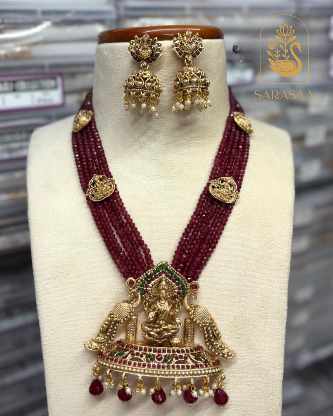 Sarasaa Maroon Beaded Multilayer Necklace Set with Goddess Lakshmi Pendant and Jhumka Earrings