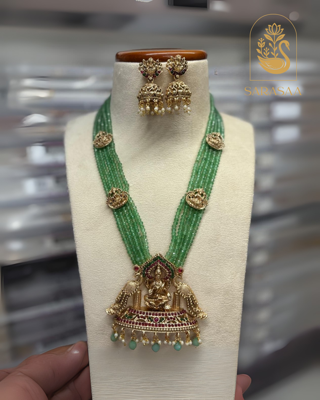 Sarasaa Green Matt Finish Goddess Lakshmi Pendant Green Beads Haram with Matching Earrings