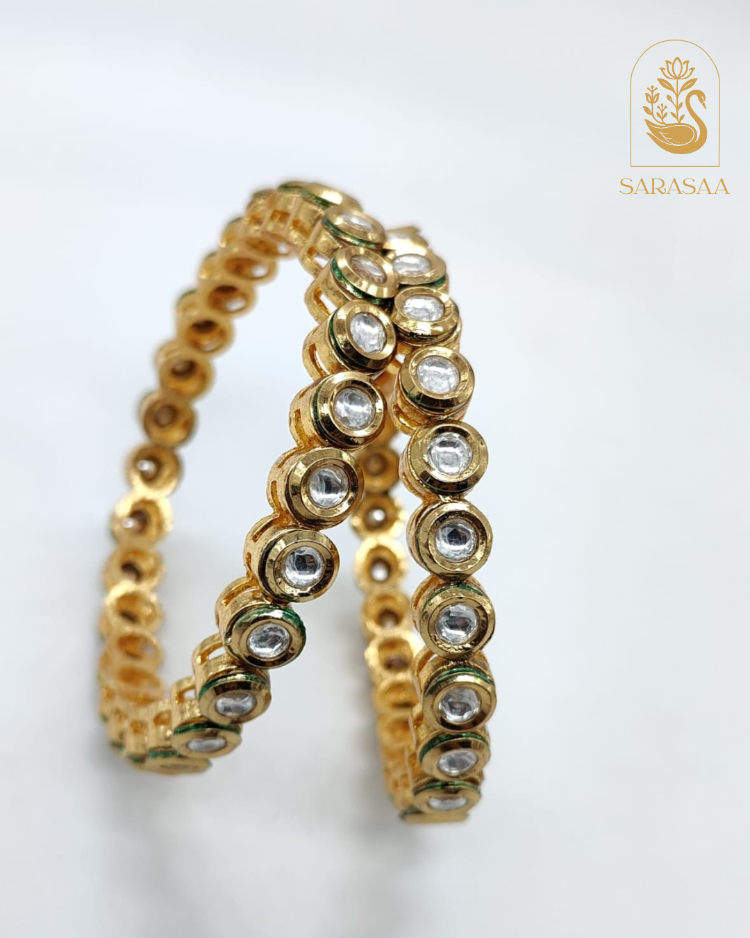 SarasaaFashion Exquisite Gold-Plated Kundan Bangles with Clear Stone Embellishments - 223