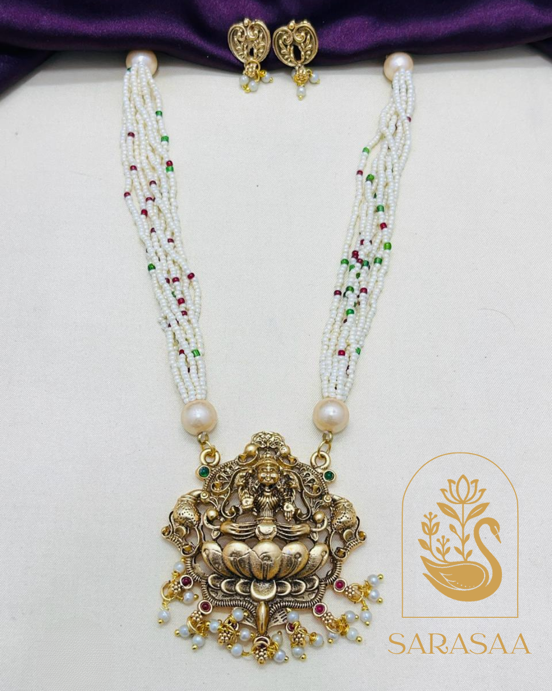 Sarasaa Antique Gold Tone Radha Krishna Temple Jewellery Set with Pearl Chain & Jhumka Earrings